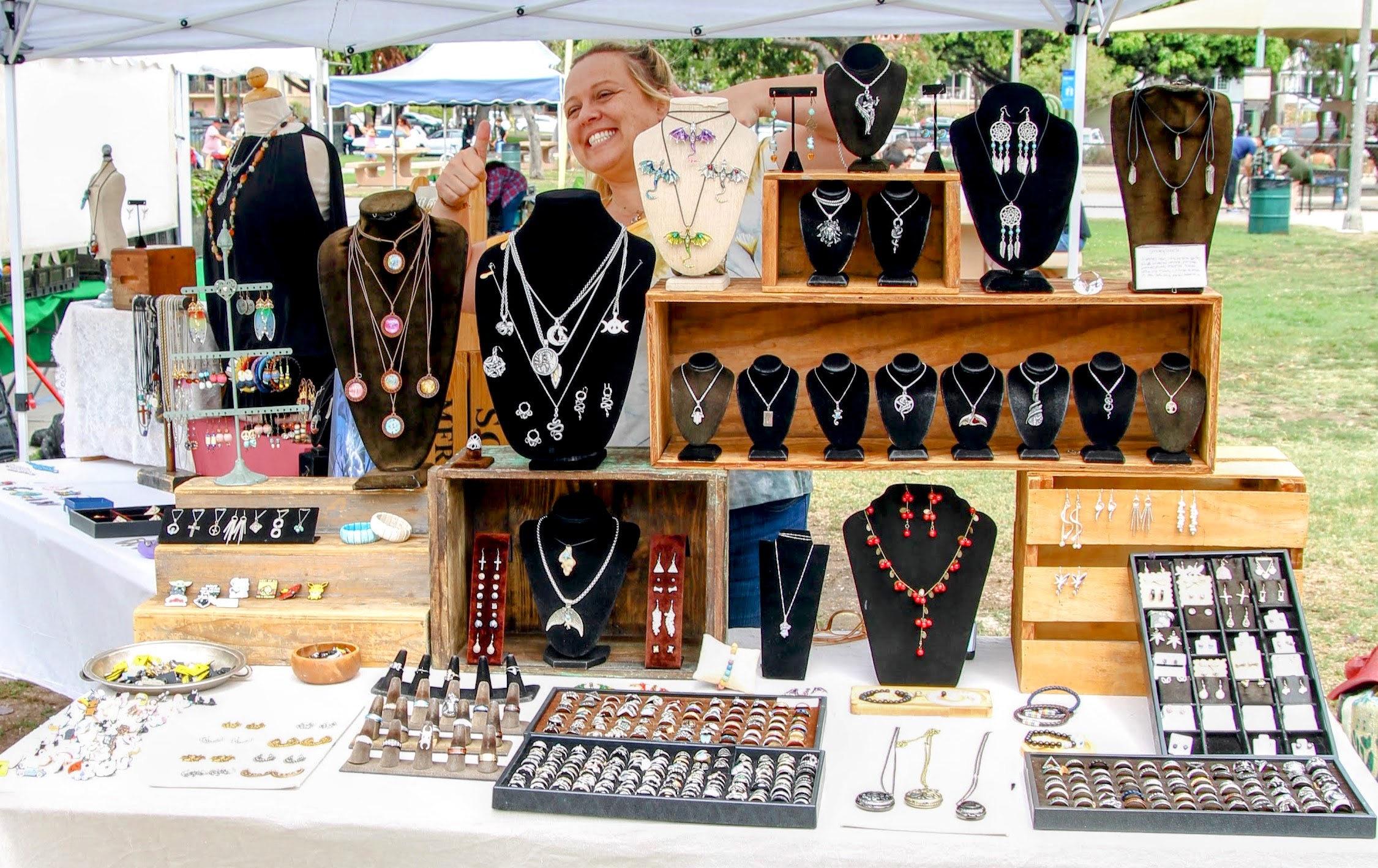 Handmade jewelry display with necklaces and rings